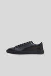 Side profile studio view of the Olen Città low-top sneaker in black calfskin leather.