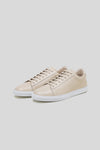 Pair of Olen beige calfskin Città sneakers with white rubber soles.