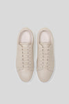 Top-down view of Olen beige calfskin Città sneakers with matching beige laces.