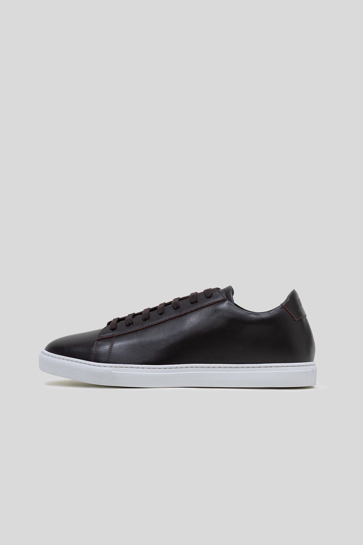 Side profile view of the Olen dark brown calfskin Città low-top sneaker.