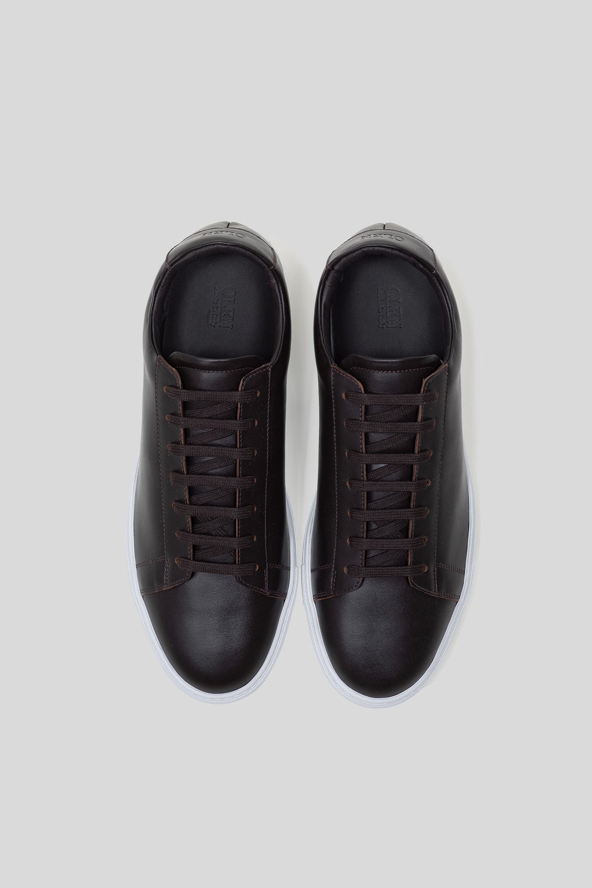 Top-down view of Olen dark brown calfskin Città sneakers with matching dark brown laces.