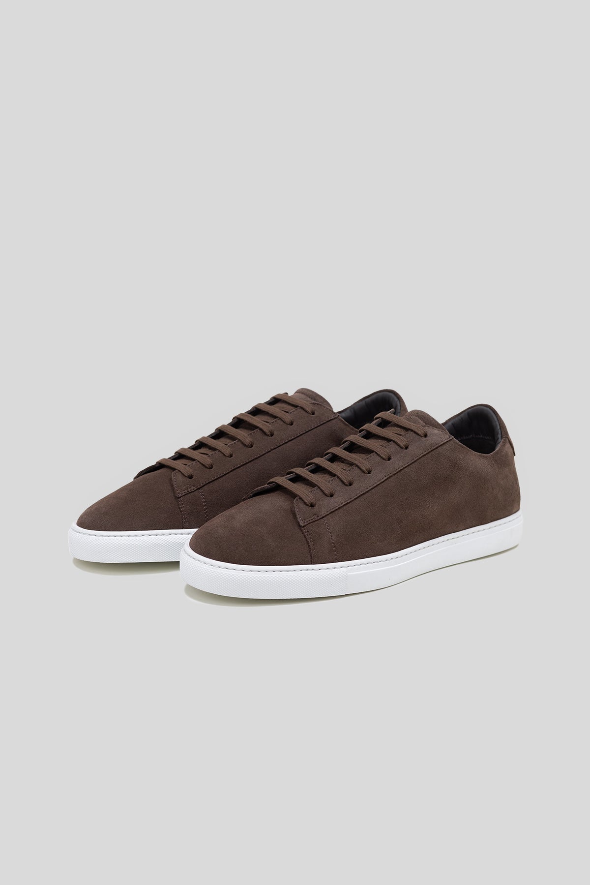 Pair of Olen dark brown suede Città sneakers with white rubber soles.