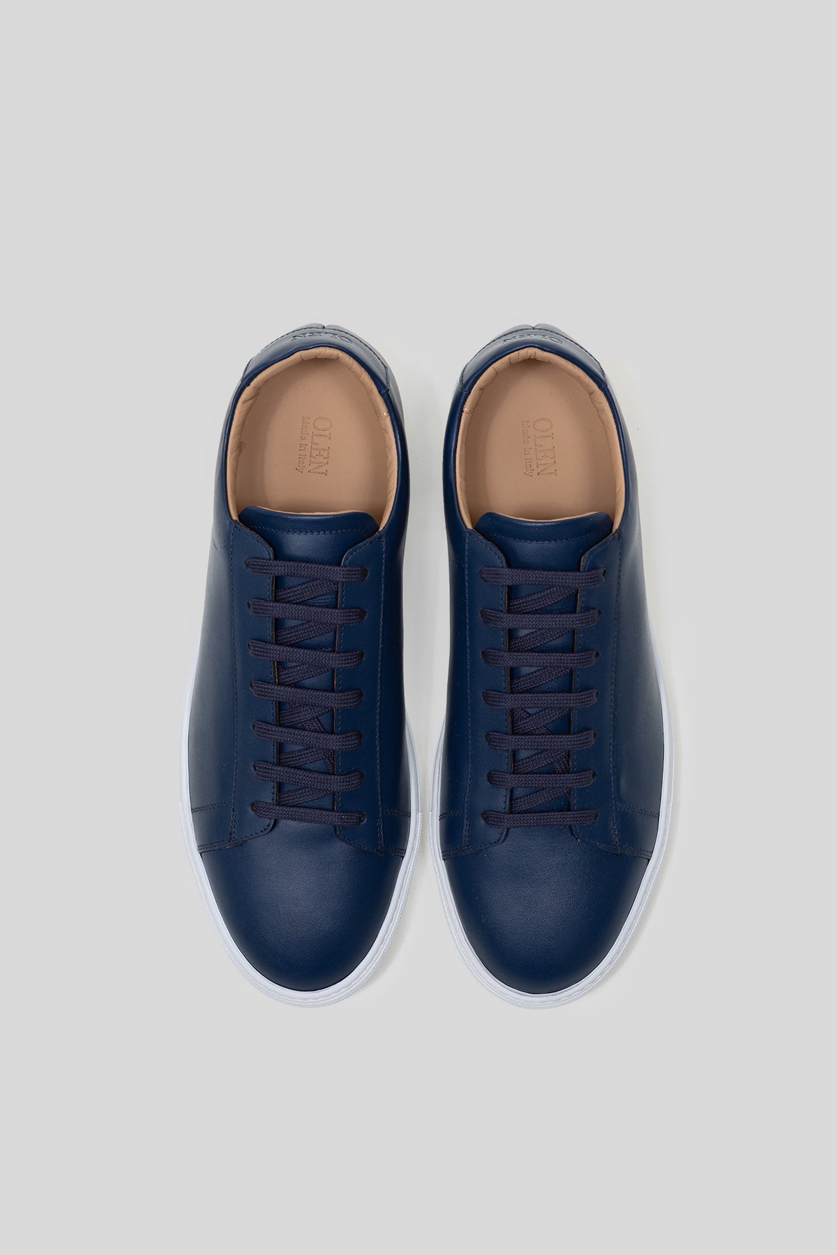 Top-down view of Olen royal blue calfskin Città sneakers with matching blue laces.